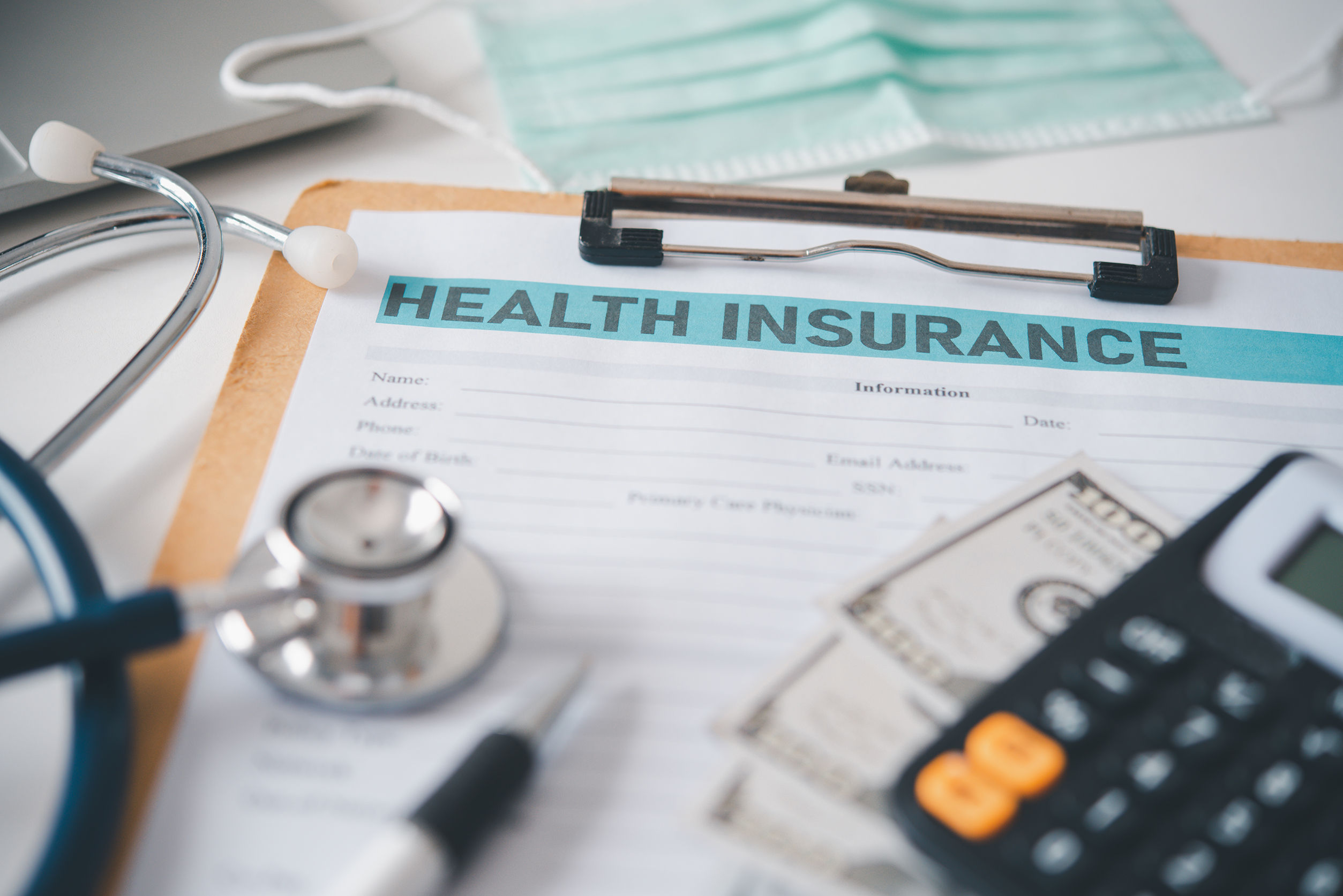 stethoscope and calculator placed on health insura 2024 03 14 16 51 51 utc